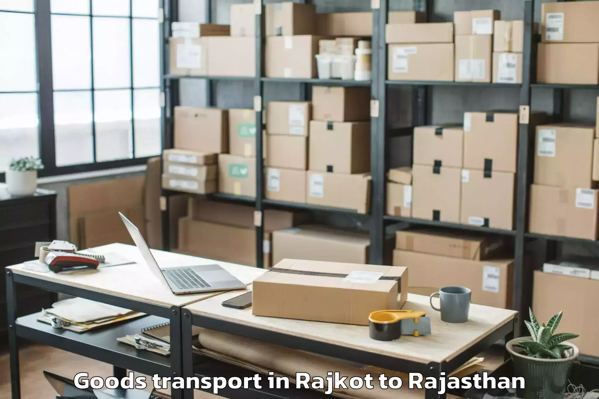 Reliable Rajkot to Opjs University Churu Goods Transport